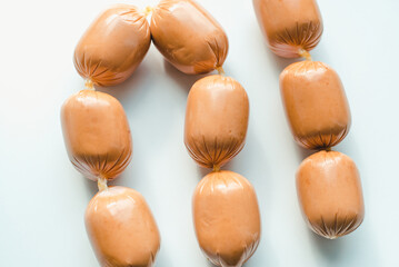 A bunch of sausages on a white background. Sausages on a white background.