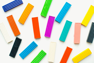 Fototapeta premium Children's plasticine on a white background. Colored plasticine.