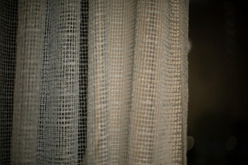 Curtains on window in evening. Fabric covers window.