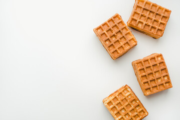 Confectionery products. Waffles on a white background. Soft waffles on a white background.