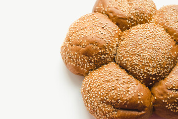 Baton on a white background. Camomile bun on a white background.
