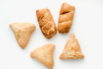 Pie with filling on a white background. Cabbage pie.