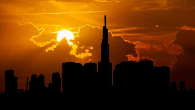 Vietnam: Ho Chi Minh City or Saigon Skyline at Sunset, Time Lapse with Red Sun and Fiery Sky