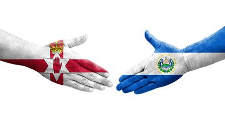 Handshake between El Salvador and Northern Ireland flags painted on hands, isolated transparent image.