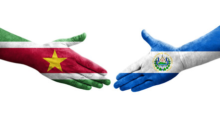 Handshake between El Salvador and Suriname flags painted on hands, isolated transparent image.