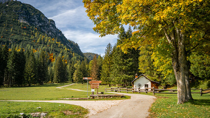 landscape in the mountains with the cozy house in Dolomites