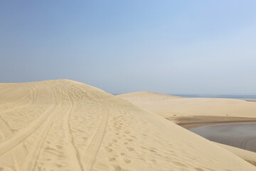 white dunes next to the inland sea in the desert of Qatar