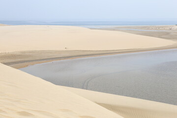 white dunes next to the inland sea in the desert of Qatar