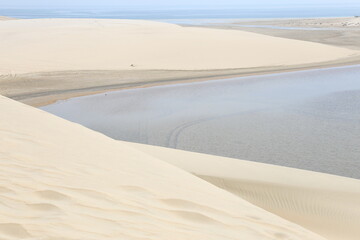 white dunes next to the inland sea in the desert of Qatar