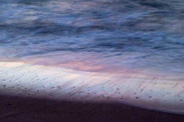Wave on sand background at coast, beautiful texture wavy white foam blue ocean on beach coastline,sandy with sea nature. transparent water seascape island photography,vacation tropical summer.
