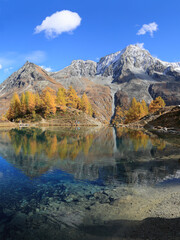 Lac Bleu of Arolla lake in Canton Valais in colorful autumn season with reflection of Dent de...