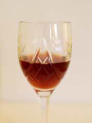 crystal glass of red wine on a white background