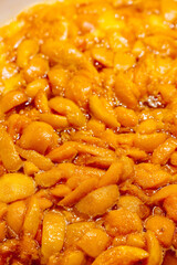 Apricots are cooked in a pan. Apricot jam. Pieces of fruit. Home preservation.