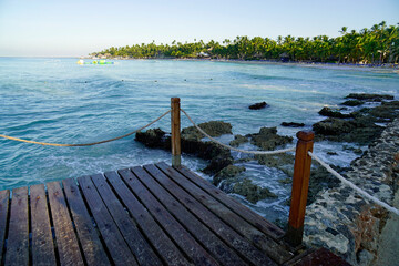 Fototapeta premium wooden jetty at a caribbean beach in the morning