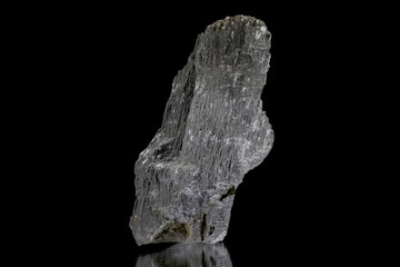 Clear white gypsum crystal on black background