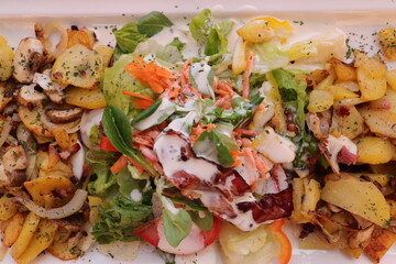a delicious salad with fried potatoes

