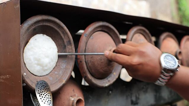 Making Surabi Bandung using Traditional Earthen Ware