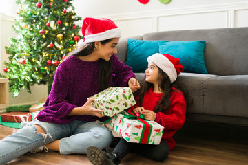 Happy mom and kid excited about their christmas presents