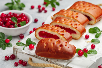 Homemade freshly baked pie with jelly and fresh organic cranberries. Delicious pastries for tea. Berry cake. Breakfast. Dessert. Healthy nutrition. Scandinavian, Nordic cuisine. Selective focus