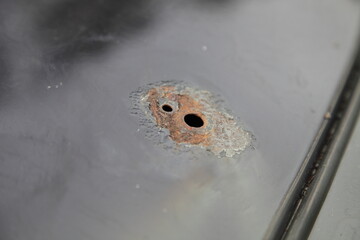 Car roof corrosion under aerial
