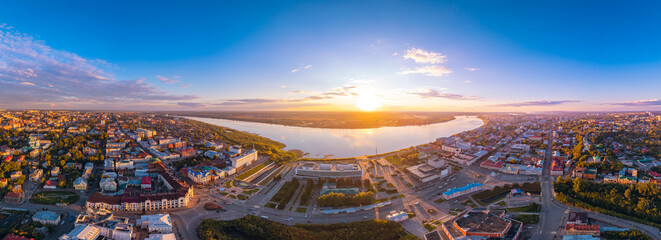 Panorama city Tomsk and Tom River with sunlight. Aerial top view