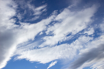 Beautiful clouds in the blue sky. Evening cloudscape.