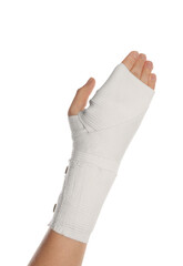 Woman with hand wrapped in medical bandage on white background, closeup