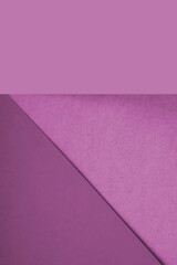 Textured and plain pink purple sheet papers forming two triangles and vertical blank rectangle for creative cover designing