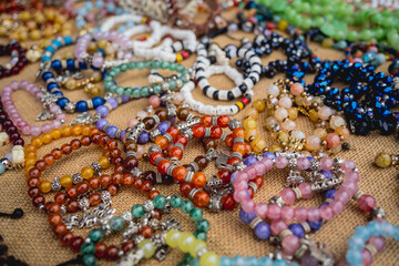Fototapeta premium Many colorful bracelets from handcraft souvenirs shop