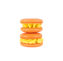 two orange homemade macarons stack isolated