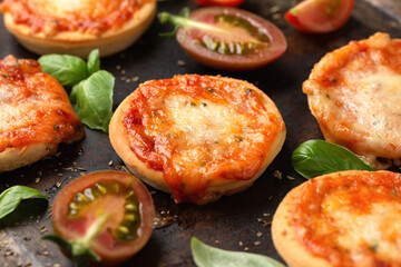 Mini pizzas with tomatoes and mozzarella cheese
