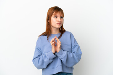 Redhead girl isolated on white background scheming something