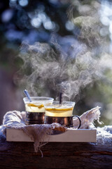 Hot steaming lemon tea outdoors - 538587641