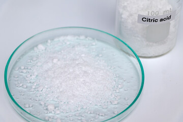 Citric acid in glass, chemical in the laboratory and industry