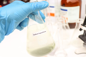 Sodium hypochlorite in glass, chemical in the laboratory and industry