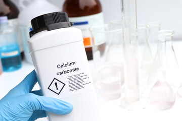 Calcium carbonate in bottle, chemical in the laboratory and industry