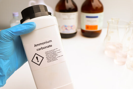 Ammonium carbonate in bottle, chemical in the laboratory and industry