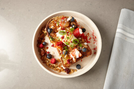 Overhead shot of fruit salad on gluten free bread