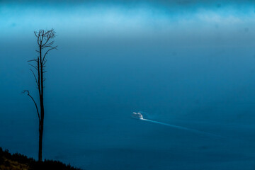 A large cruise ship leaves Madeira in search of its next destination