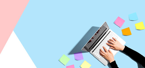 Laptop computer with many sticky notes