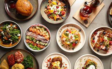 Overhead shot of multiple food dishes on table