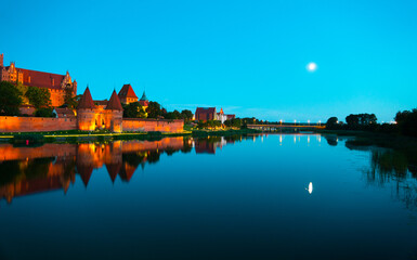Marienburg castle the largest medieval brick castle in the world in the city of Malbork evening view at night