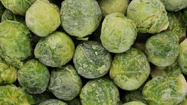 Frozen Brussels sprout top view, rotation. Healthy vegan food concept
