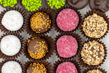 Chocolate praline. Assortment of chocolates on a white background. Top view