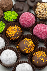Chocolate praline. Assortment of chocolates on a white background. Top view