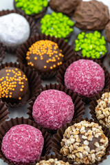 Chocolate praline. Assortment of chocolates on a white background. Top view
