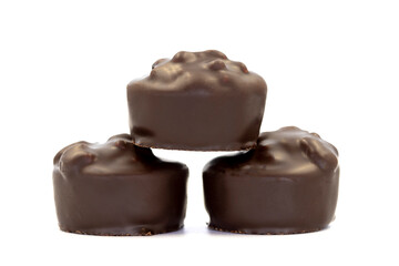 Chocolate praline. Dark chocolate isolated on a white background. close up