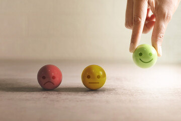 hand picking happy smile symbol face for rating feedback service, a customer satisfaction or good...