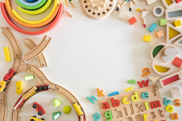 Wooden eco-friendly colored children's toys. Dice, blocks, alphabet, railroad and board games. Montessori material.