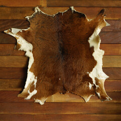 Animal skin leather on wooden background